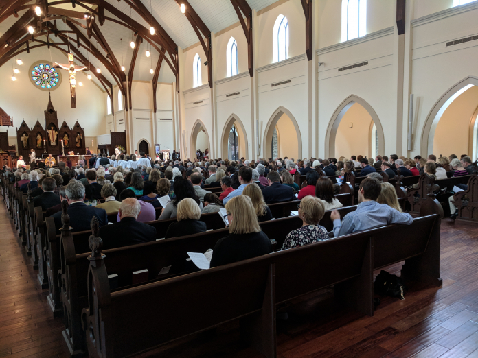 A large crowd of people in a room