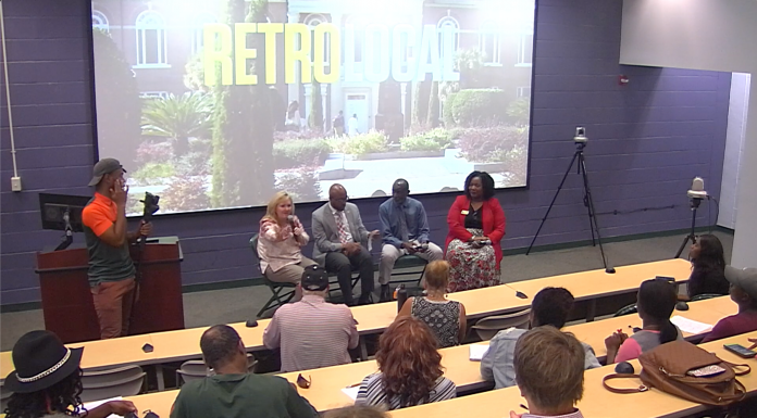 Highlights from Retro Local Screening and Panel Discussion Panel in front of Screen.