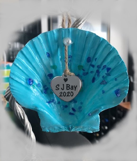 A hand holding a blue umbrella