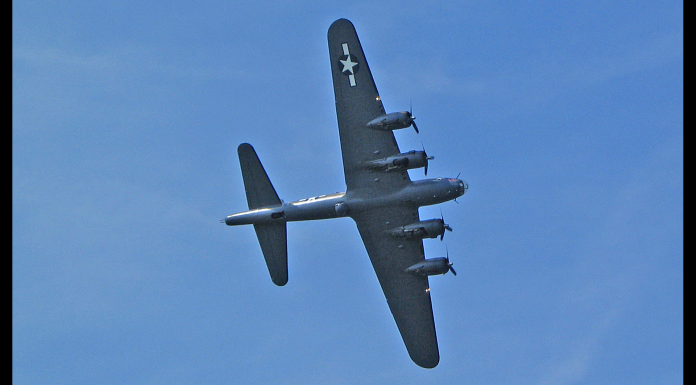 Saint Marks Bomber Rediscovered A large air plane flying in the sky