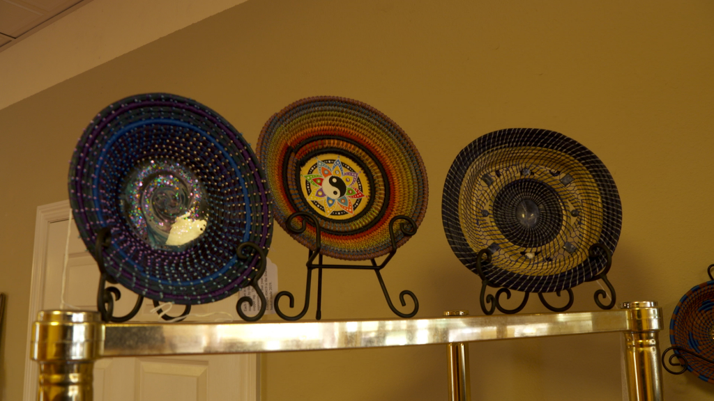 3 handwoven baskets on display