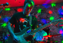 Cat Family Records and Musicians Seek Alternatives to Live Music A person sitting on a stage