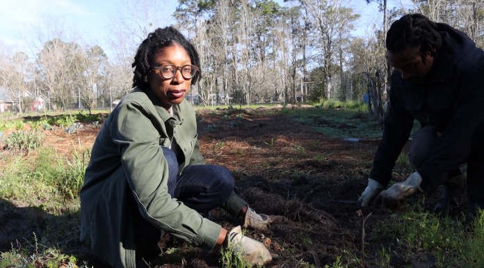 Smarter by Nature A couple of people that are standing in the grass