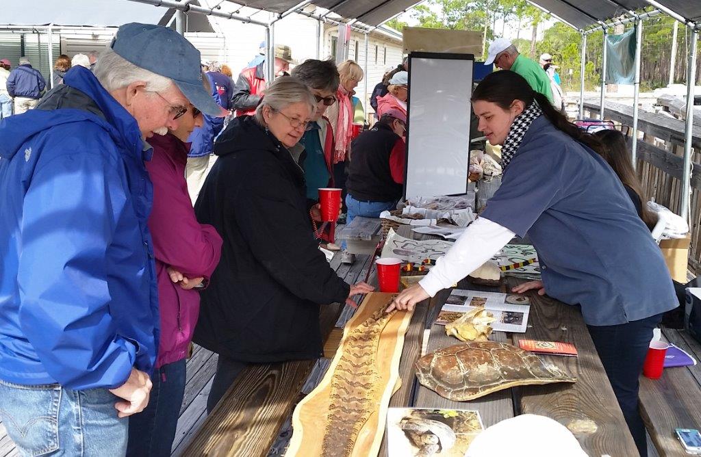 A group of people preparing food on a table