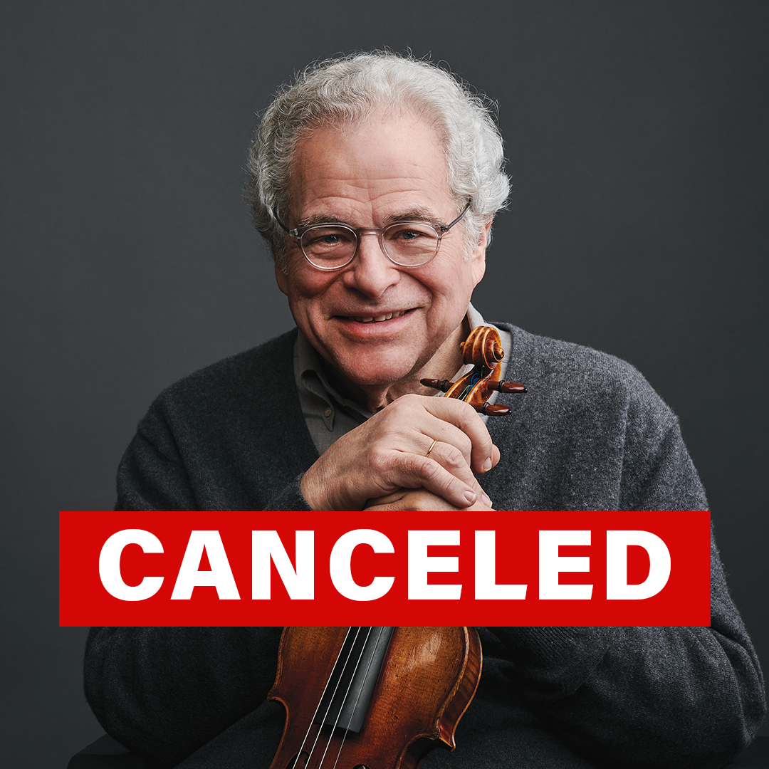 Itzhak Perlman wearing a suit and tie