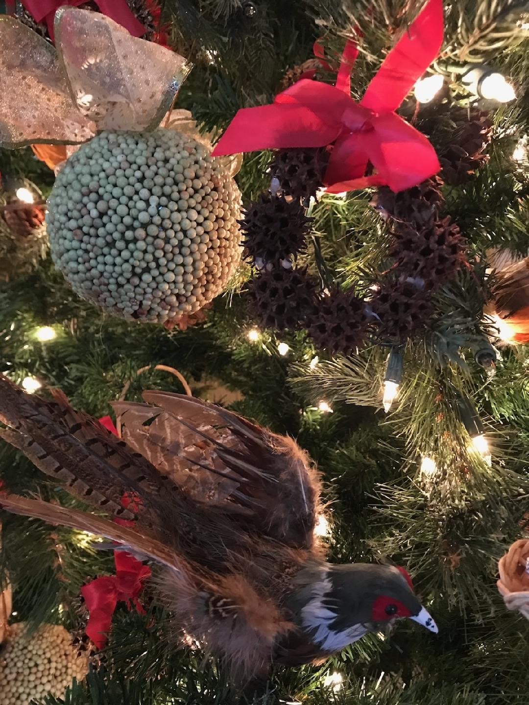 A group of stuffed animals on a plant