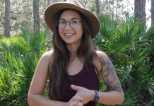 New Ecology Blogger a Researcher, Artist, and Communicator A woman standing in front of a tree