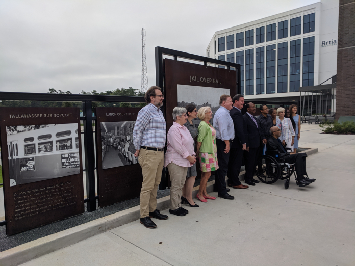 A group of people standing in front of a building