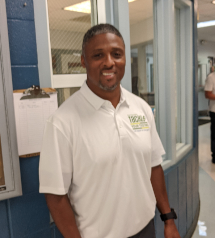 Warrick Dunn standing in a room