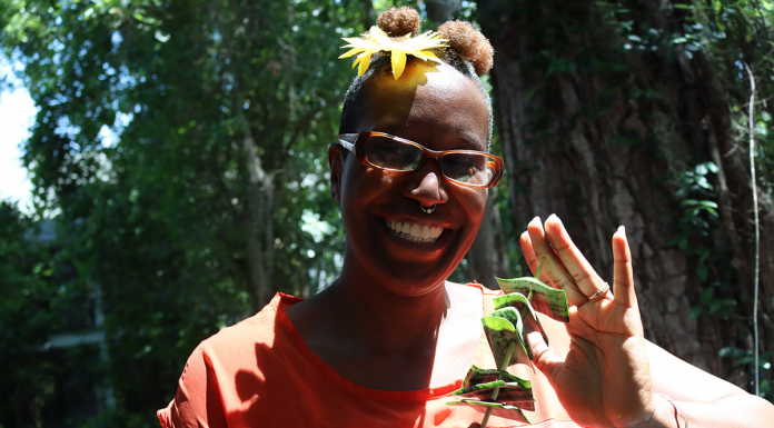Propagating Joy | Finding Love in Gifts and Discarded Nature a smiling woman holding a plant