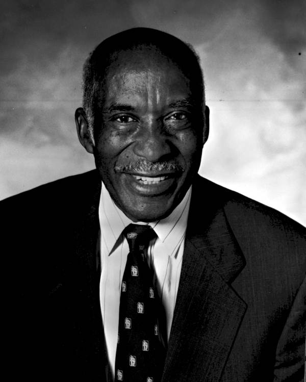 James R. Ford wearing a suit and tie