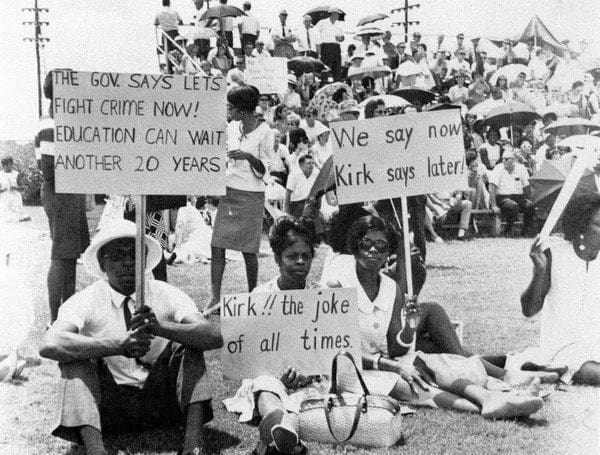 A group of people holding signs