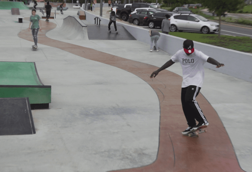 A person riding a skateboard at a skate park