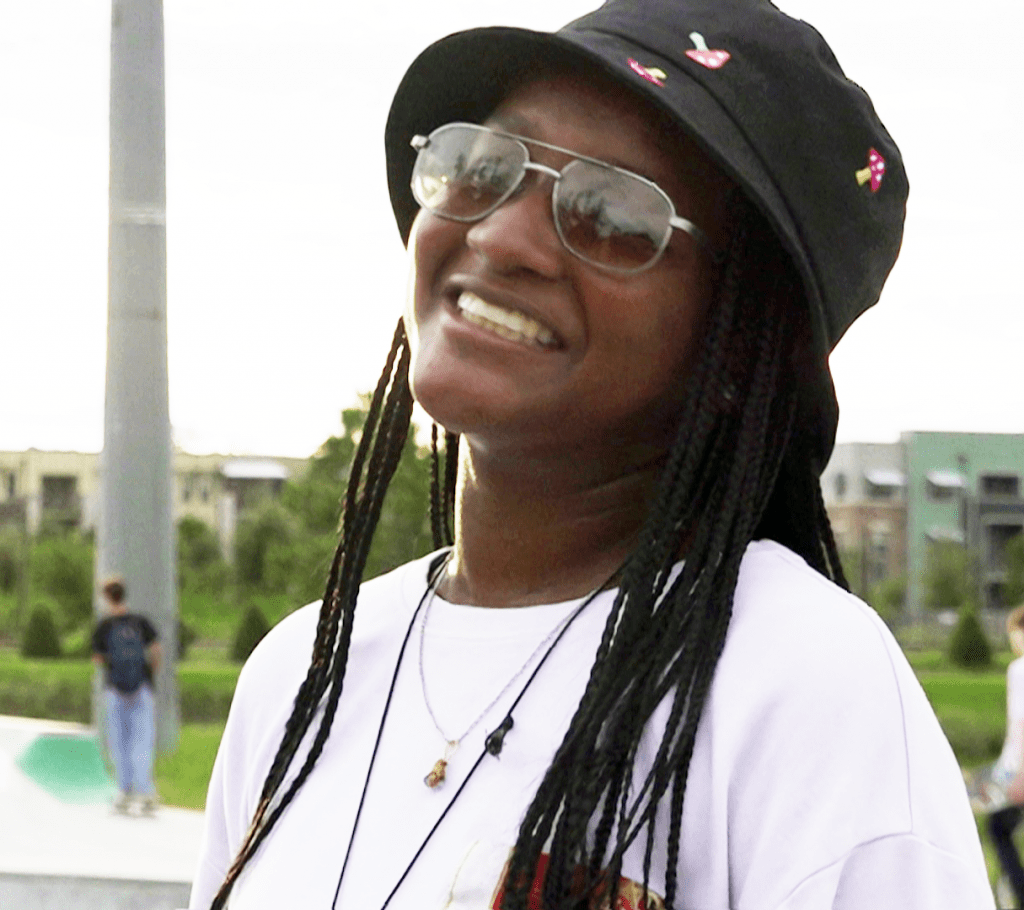 A person wearing a hat and sunglasses
