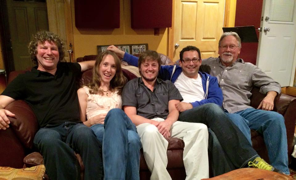 A group of people sitting posing for the camera