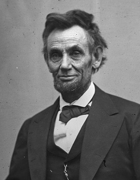 Abraham Lincoln wearing a suit and tie
