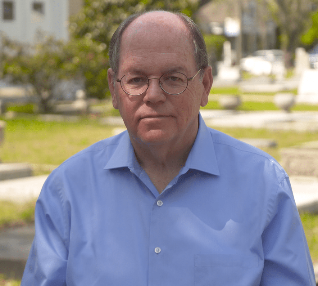 A man in a blue shirt.