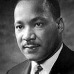 Martin Luther King, Jr. wearing a suit and tie