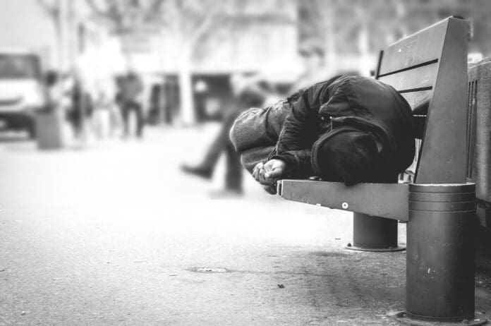 A person sitting on a bench