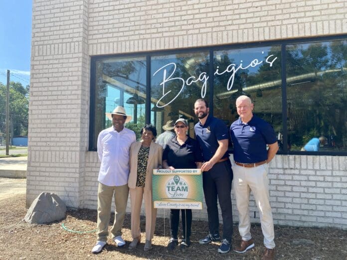 A group of people standing in front of a building