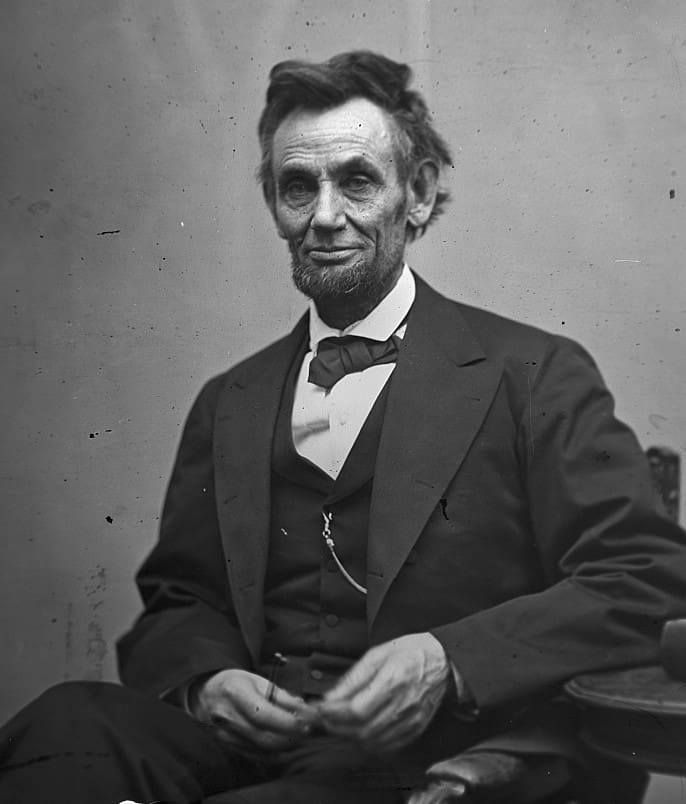 Abraham Lincoln wearing a suit and tie 