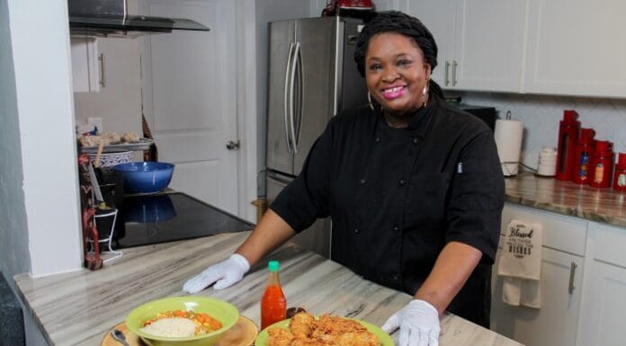 Cooking with Chef Fe A man standing in front of a plate of food