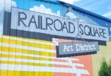 Stories Featuring Railroad Square on Local Routes A sign in front of a building