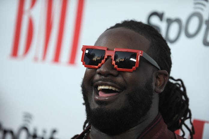 A man wearing sunglasses posing for the camera