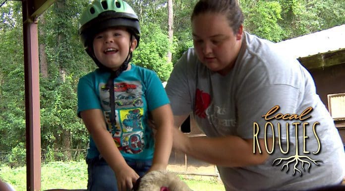 Local Routes –  Episode 304 Child smiles while horseback riding with adult