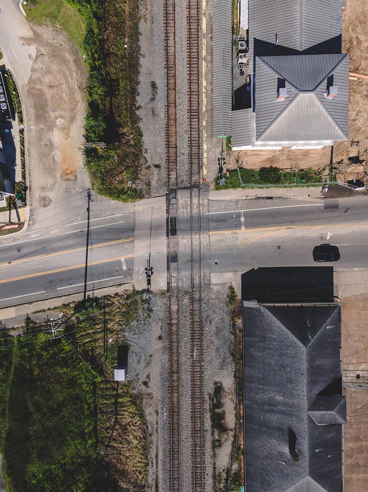 looking down at railroad tracks from the sky