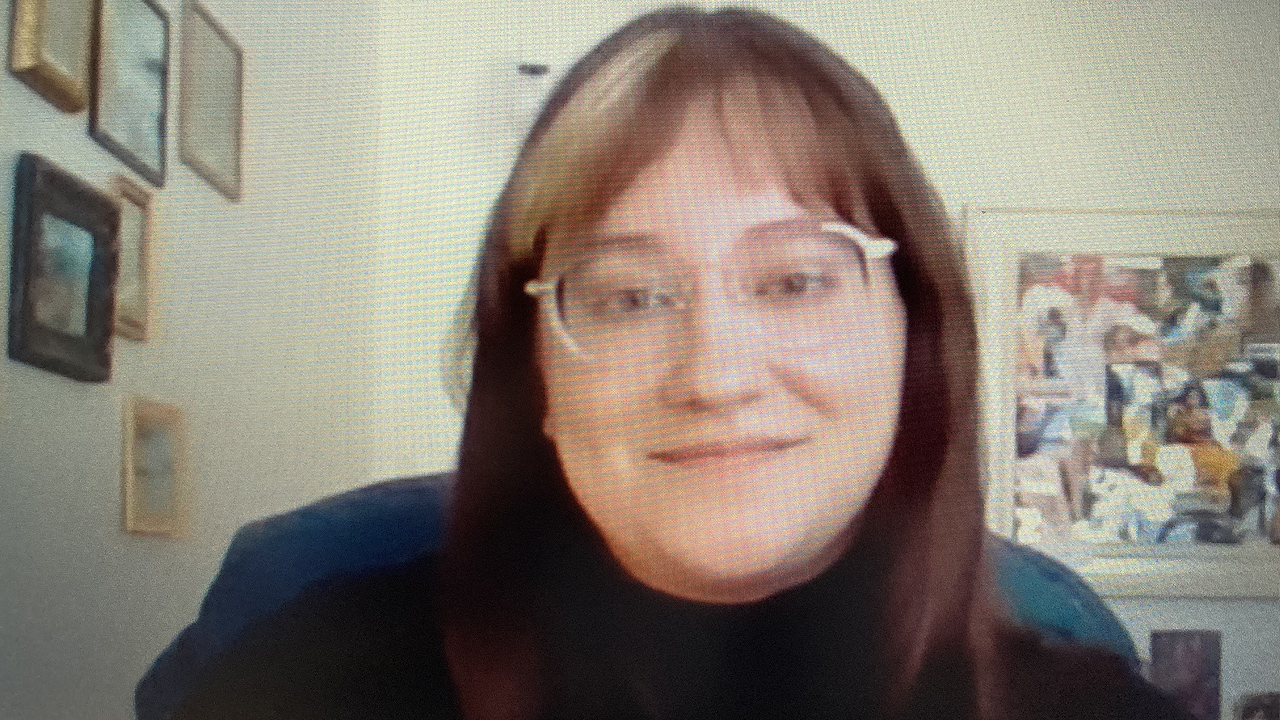 Woman in glasses smiling