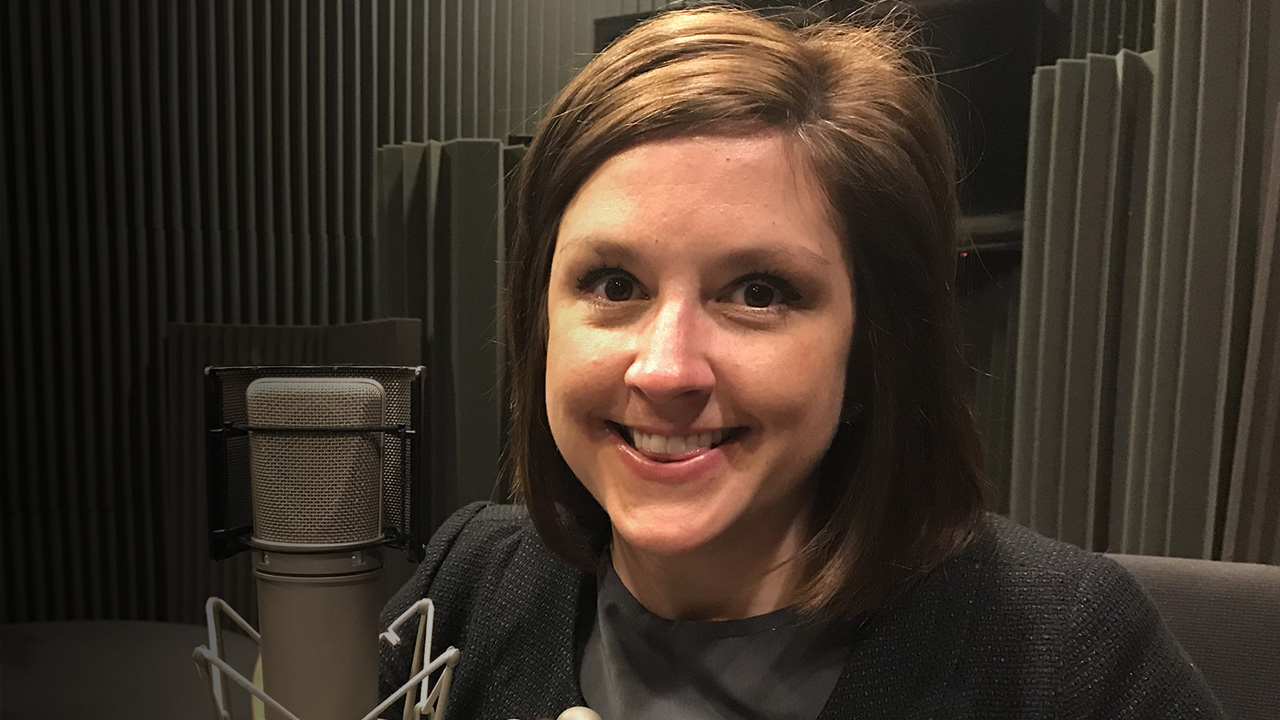 Amber smiling in the studio