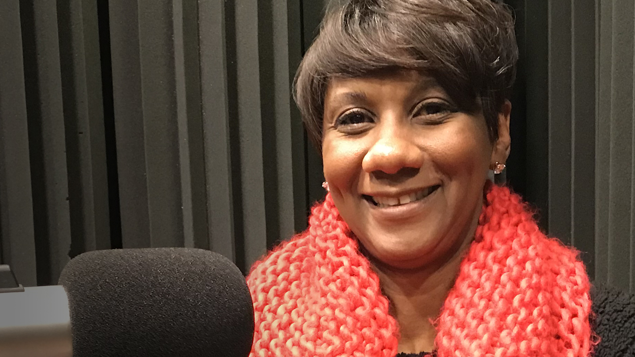 Heidi Otway sitting in WFSU's radio studio in front of the mic