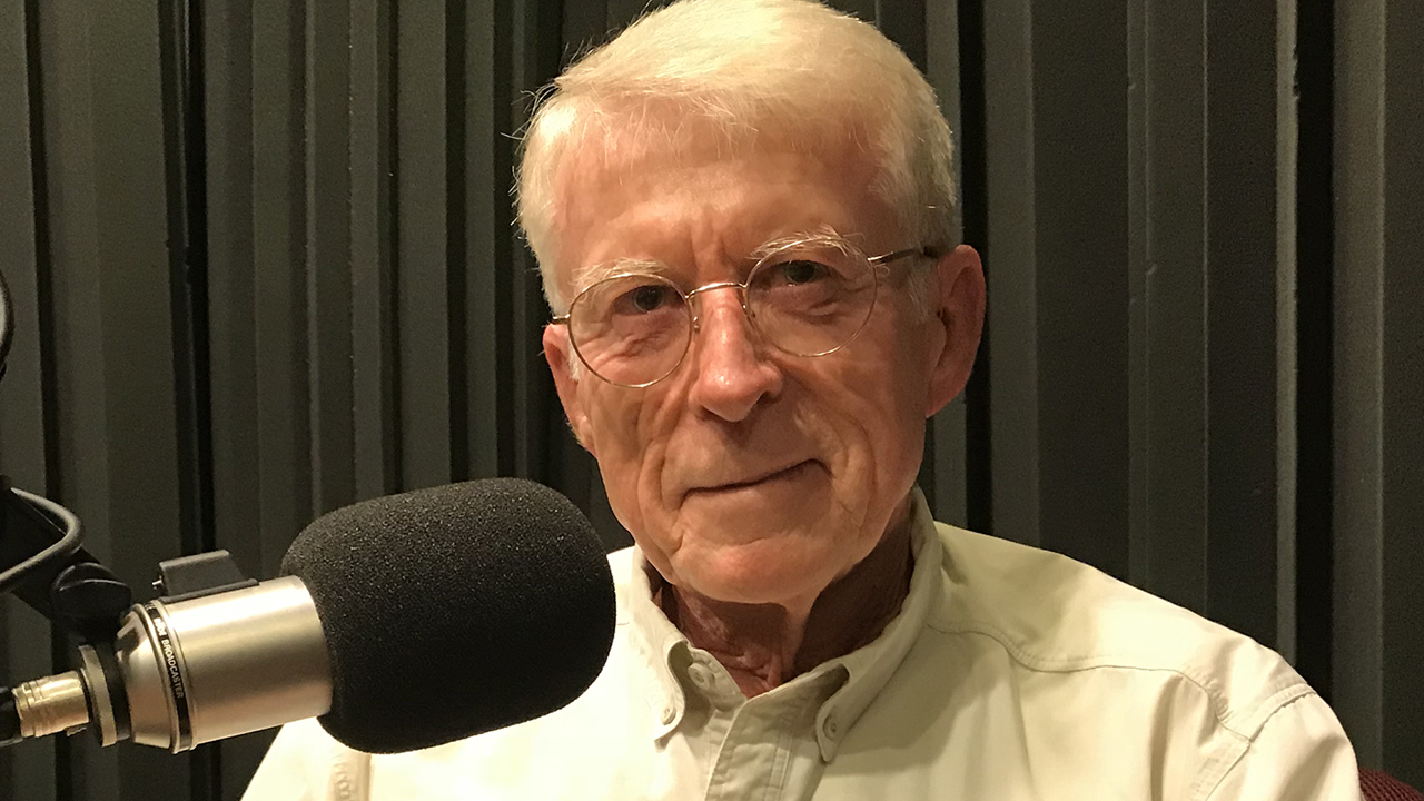 Jim in front of a microphone at WFSU