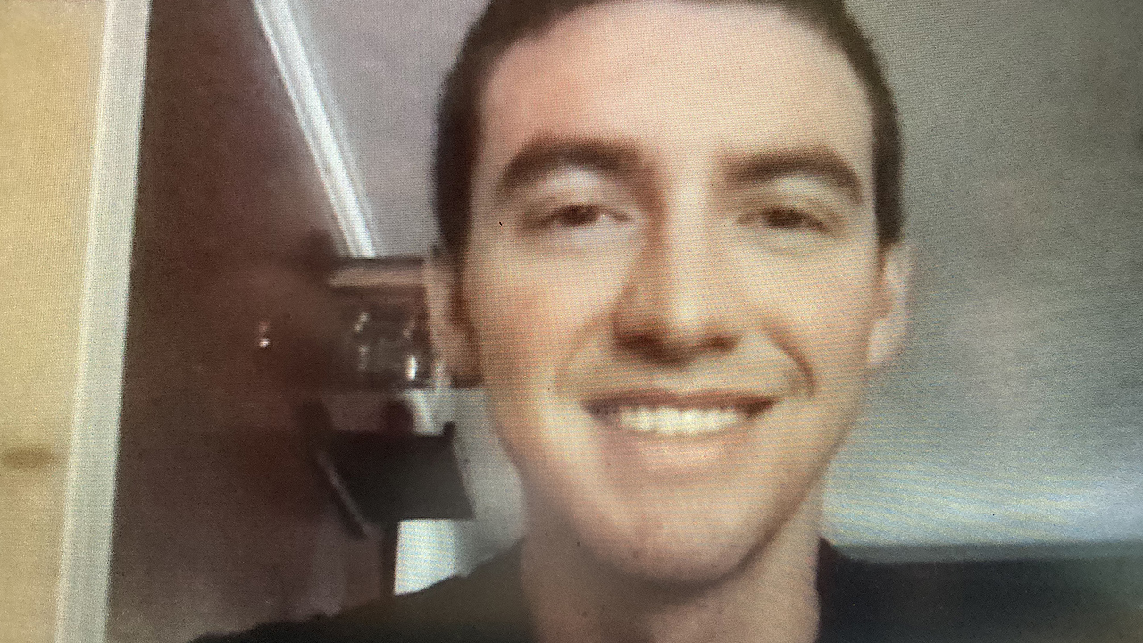 young man looking into the camera