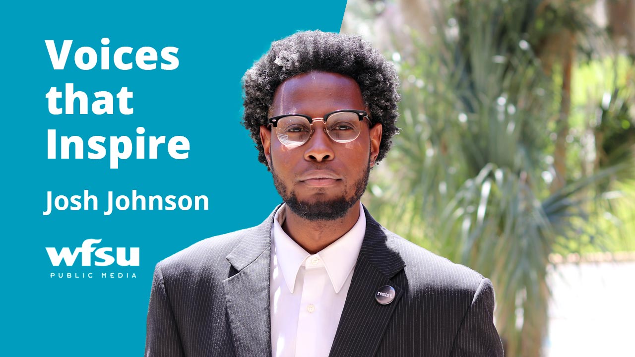 A man in a dark suit stares stoically forward.