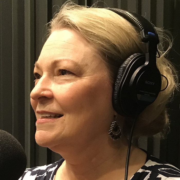 Karen Moore in front of the microphone