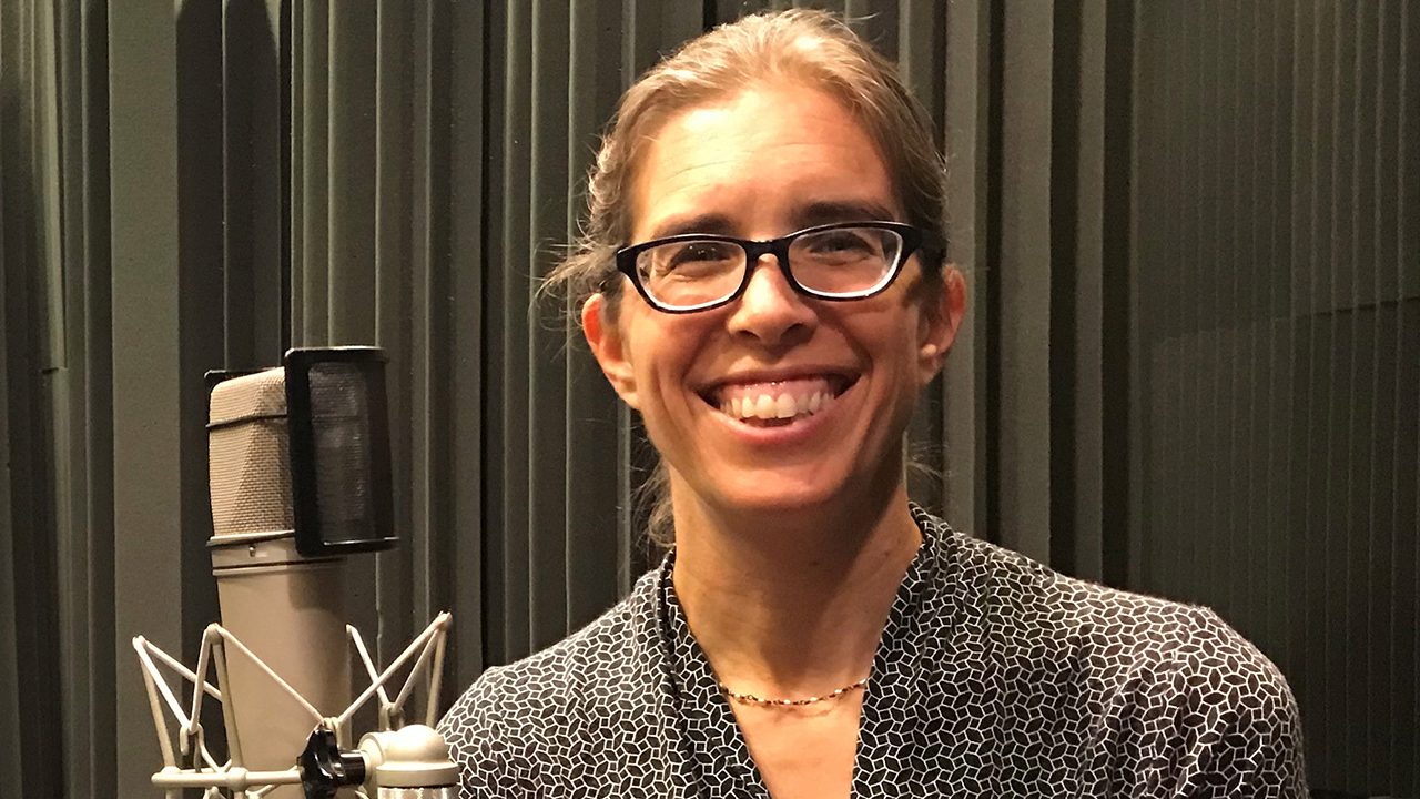Marie-Claire smiling in the radio studio