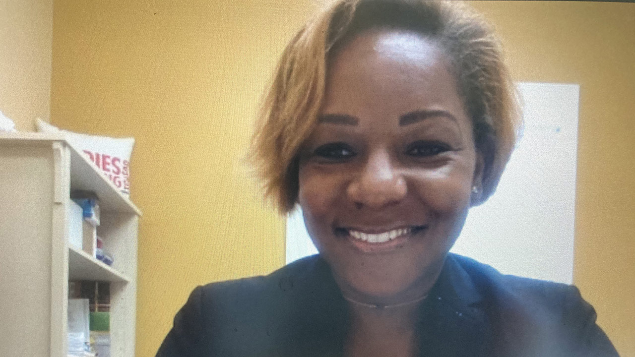 Samantha smiling into the camera