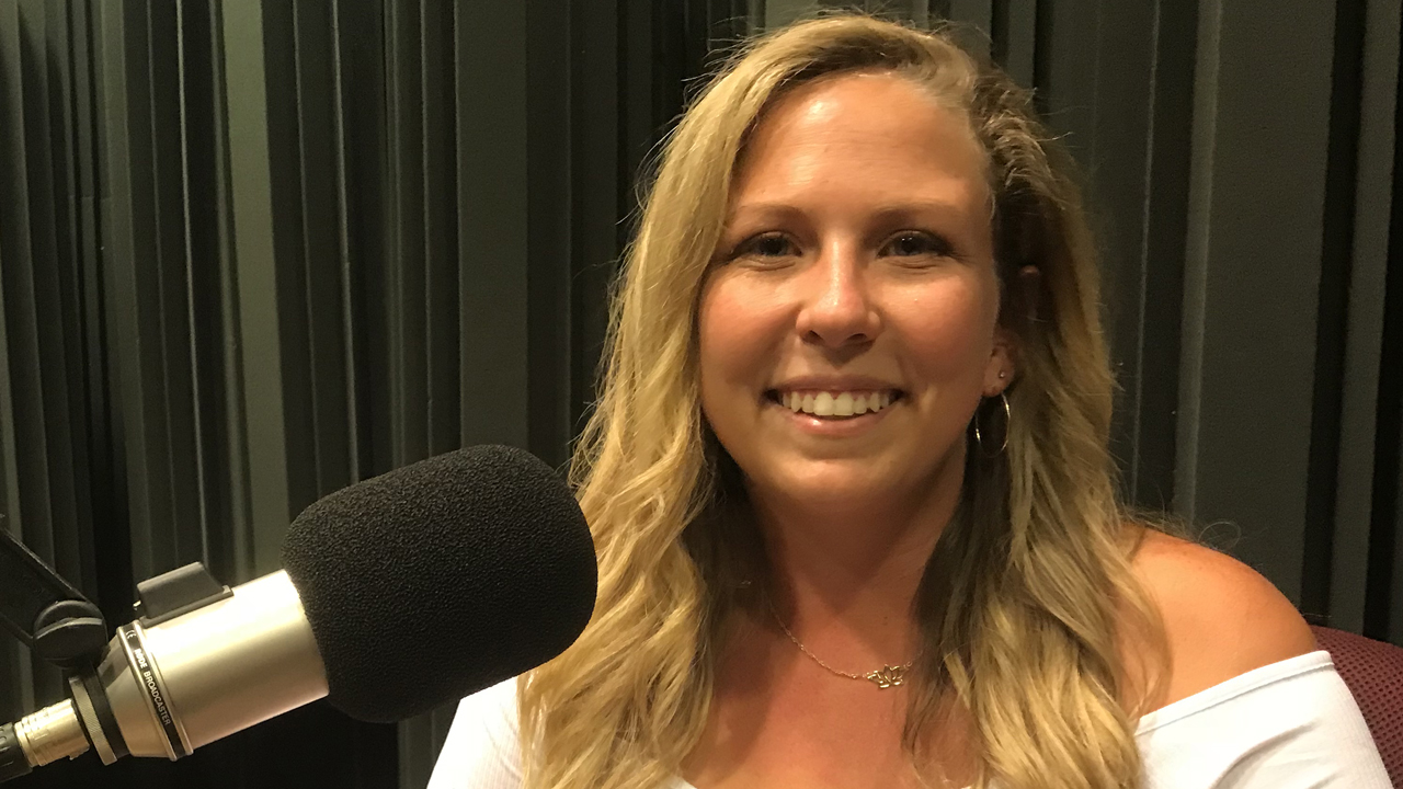 Sarah in front of the microphone