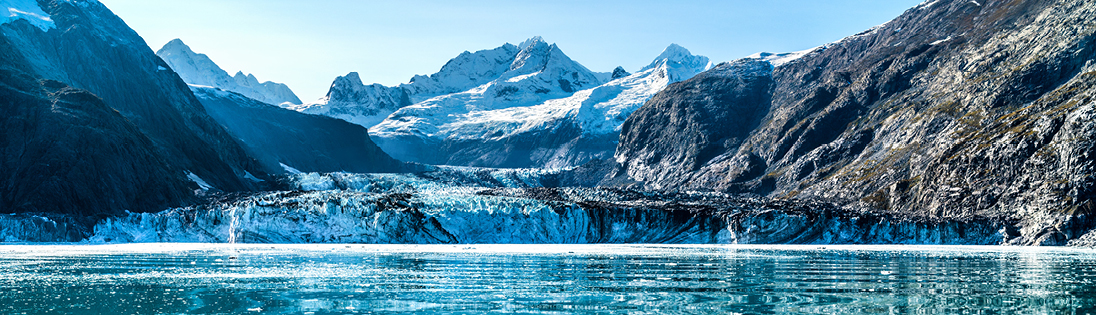 snowcapped mountains and a body of water