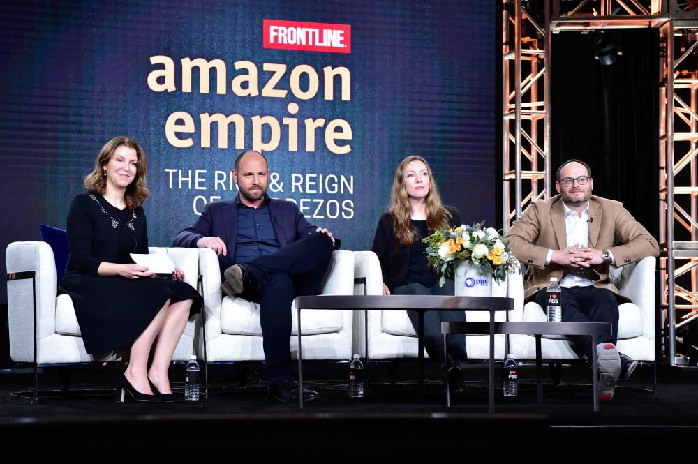 Four people sitting on chairs