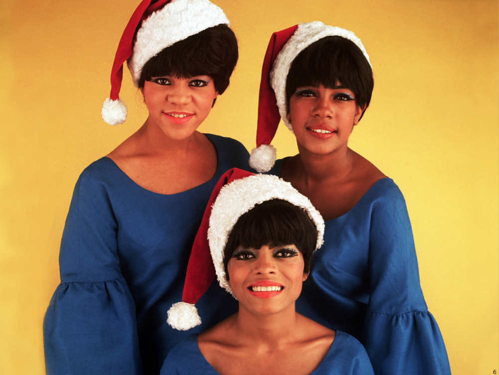 Three girls in santa hats