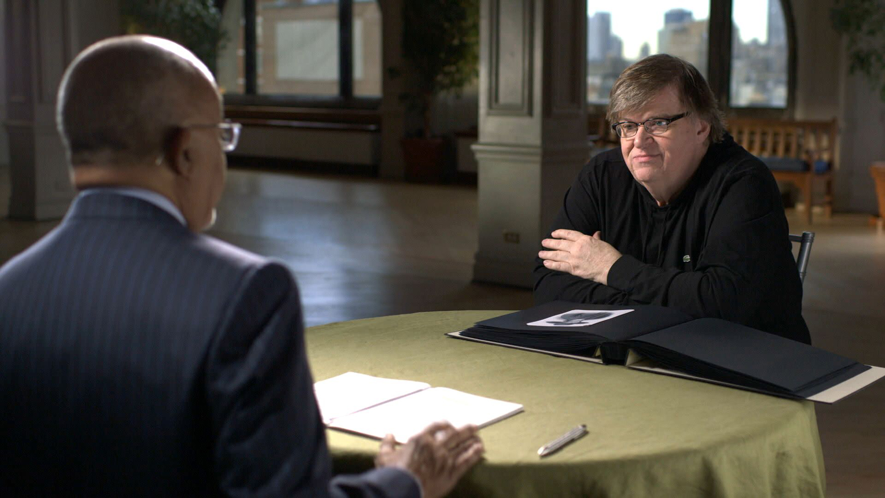 Host Henry Louis Gates, Jr. and Michael Moore
