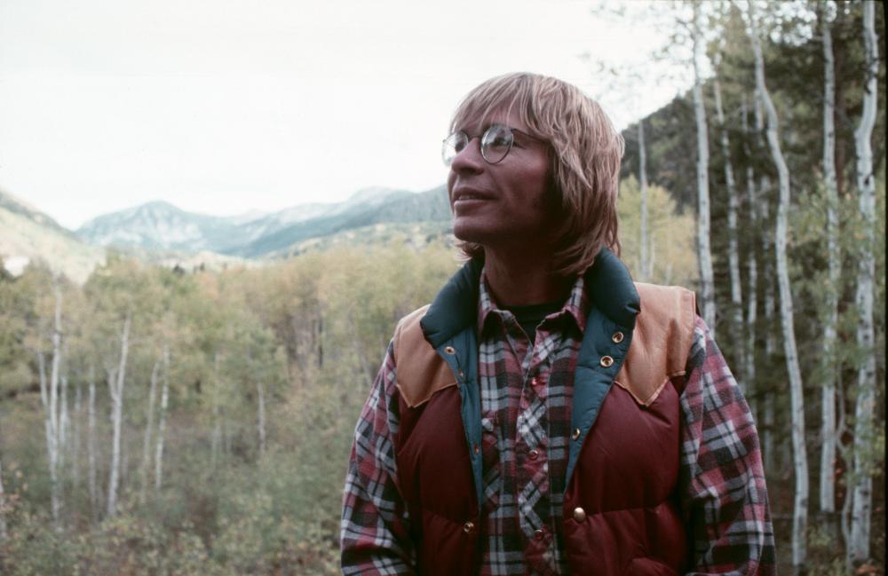 John denver smiling with some cool sunglasses on