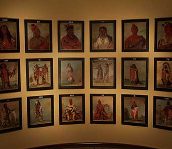 paintings of ancient civiliations in a grid on a wall