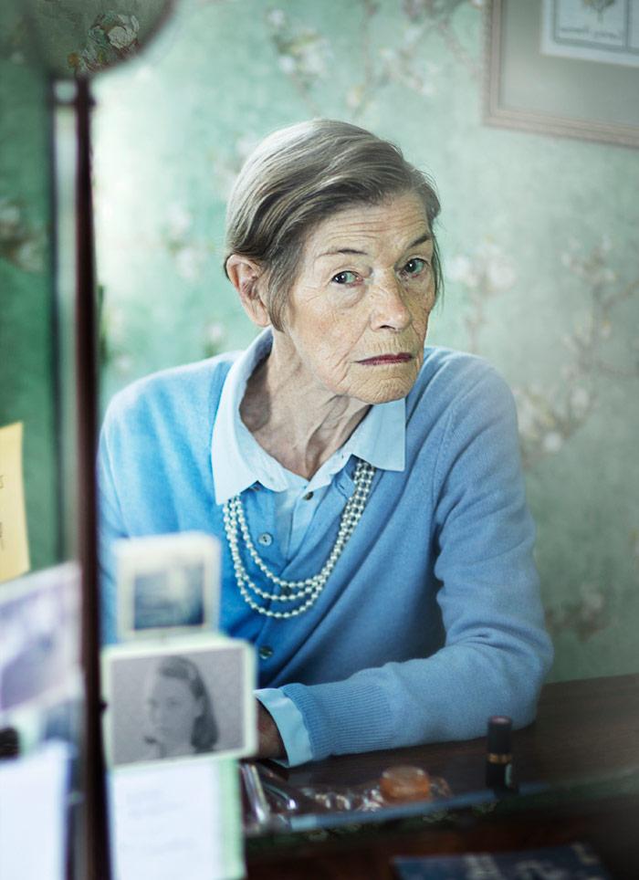 older woman in a blue sweater