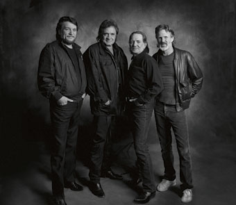 black and white photo of 4 members of the band from head to toe